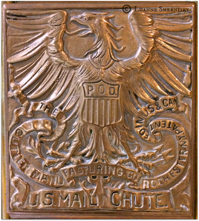 Old fashioned bronze metal plate on U.S. Mail Chute